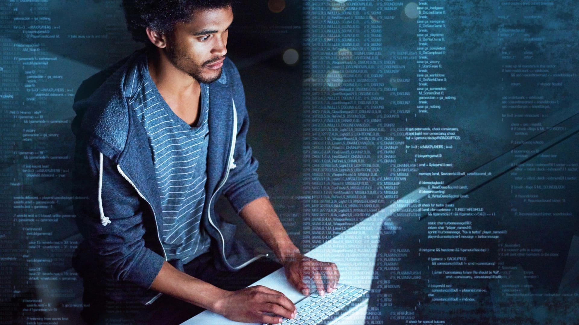 Man typing on desktop computer