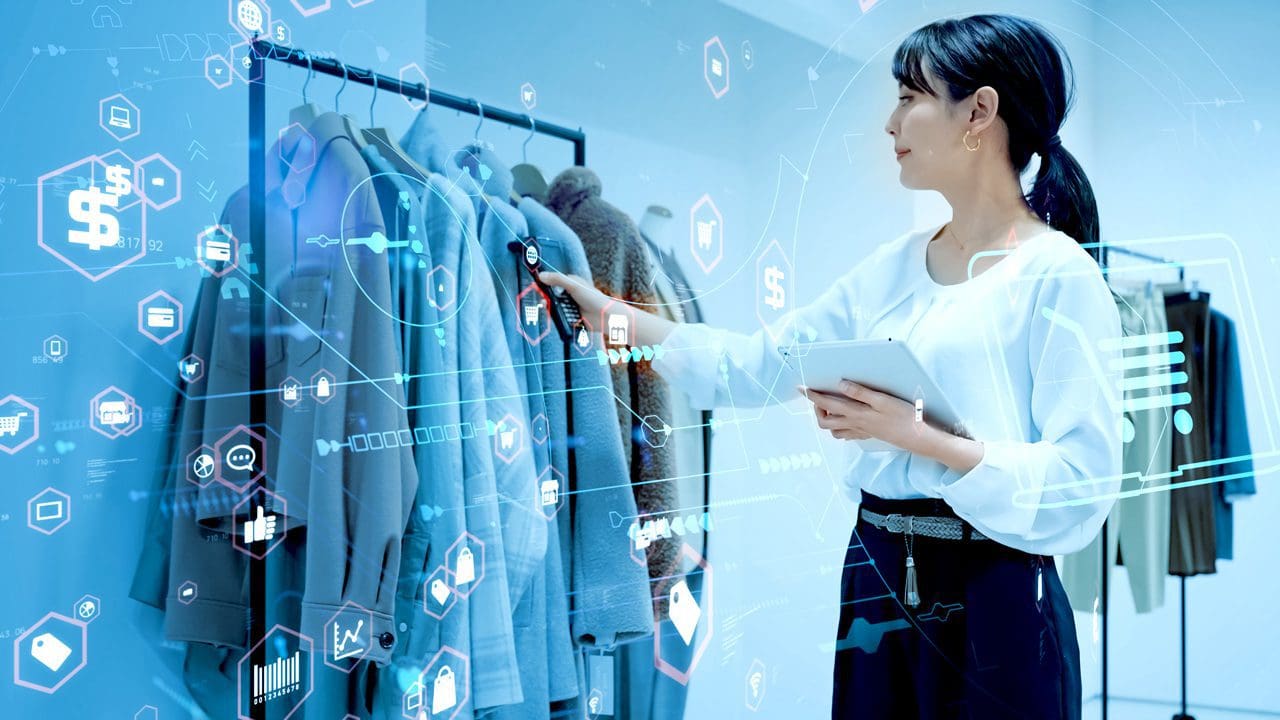 Woman scanning a rack of clothes