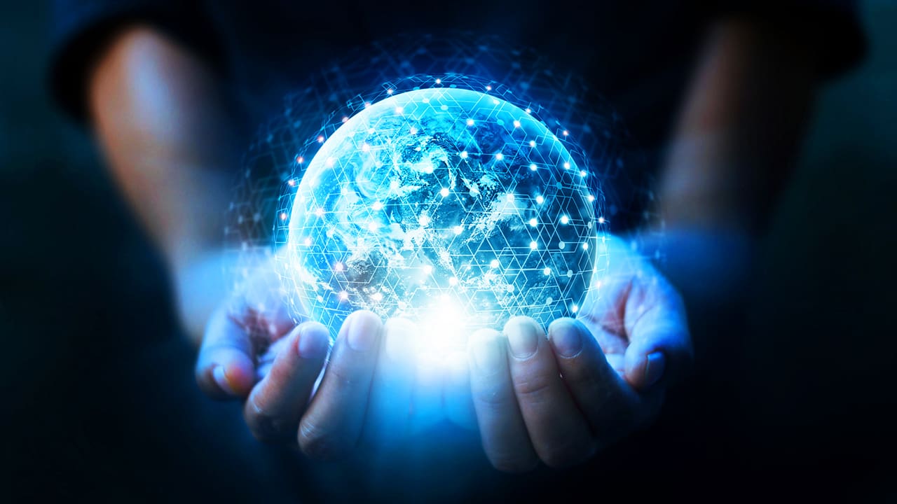 Hands underneath a digital globe.