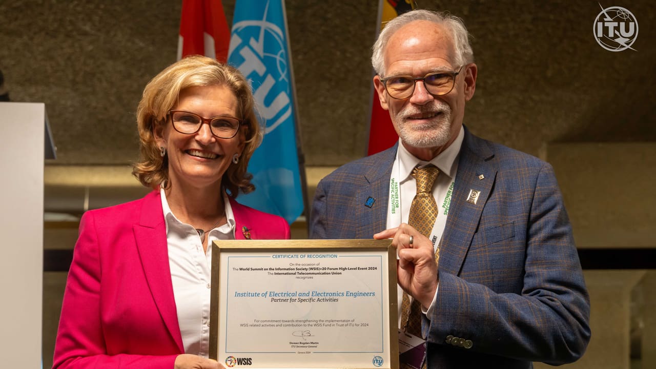 2024 IEEE President Tom Coughlin receives a certificate from ITU Secretary-General Doreen Bogdan-Martin at the WSIS+20 Forum.