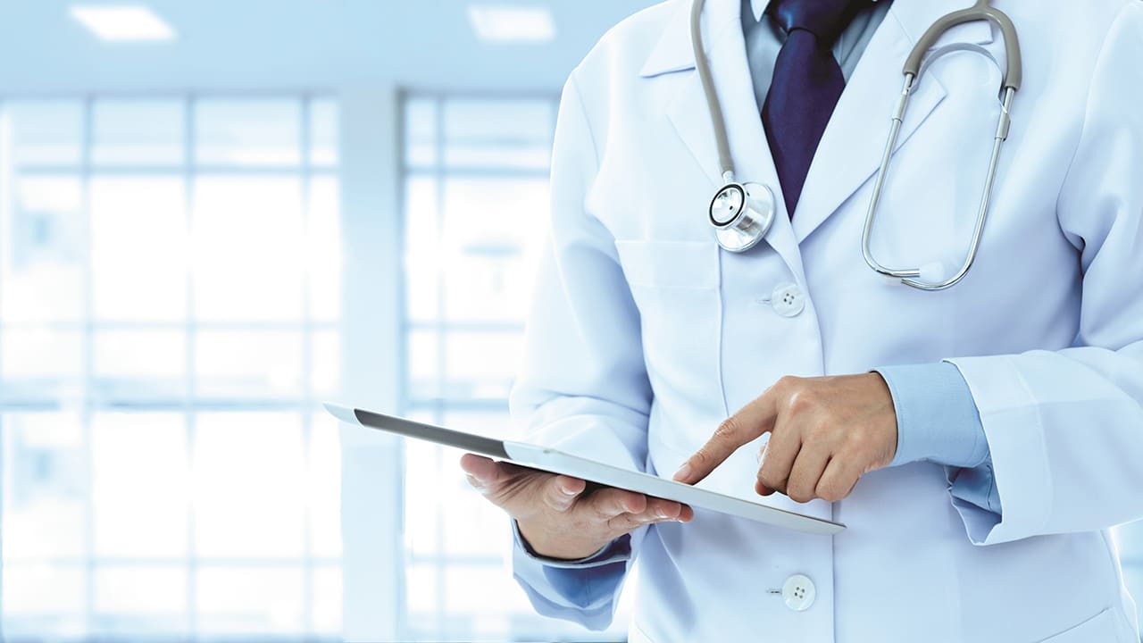 Doctor using a tablet device.