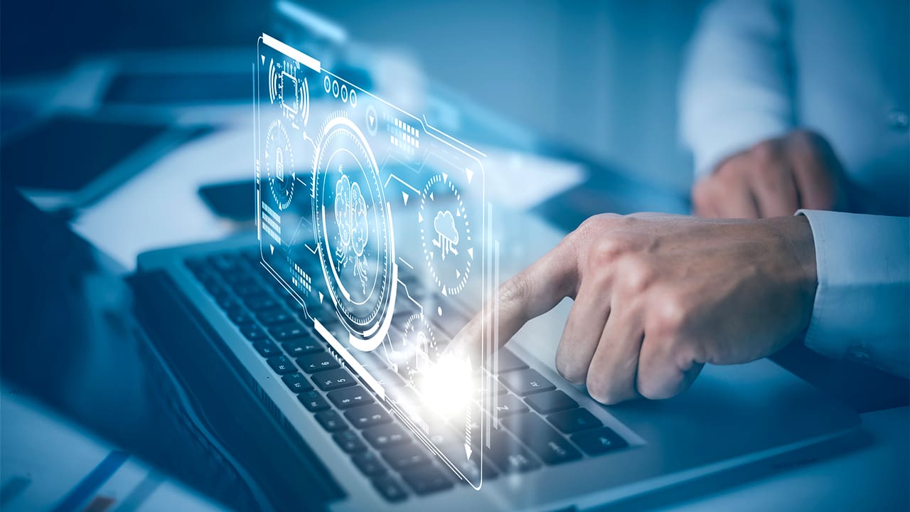 Person touching a medical overlay being shown from a laptop.